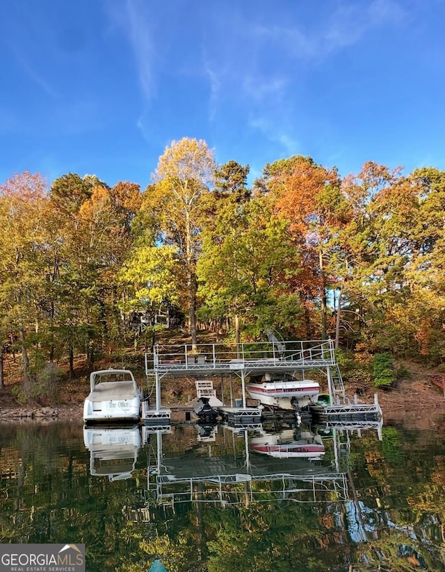 exterior space with a water view and boat lift