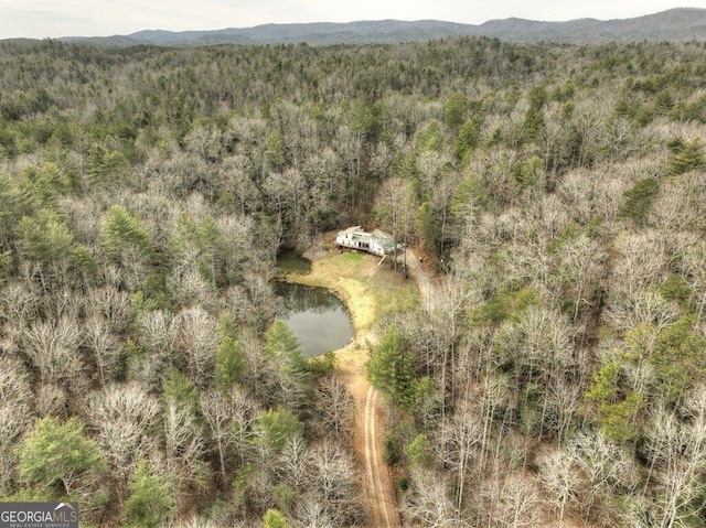 aerial view featuring a mountain view and a wooded view