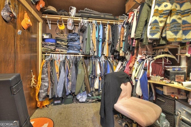 walk in closet featuring carpet