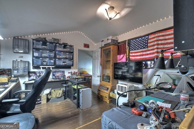 office with wood-type flooring and vaulted ceiling