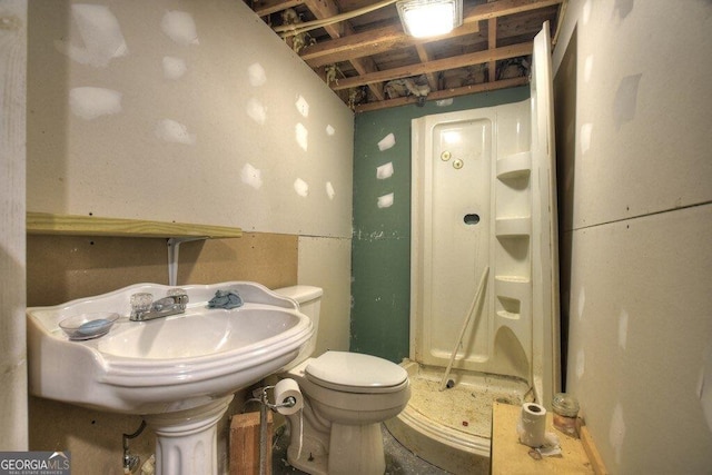 bathroom with toilet and a sink