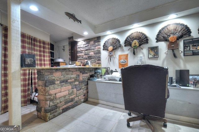 office space with a textured ceiling, tile patterned flooring, and recessed lighting