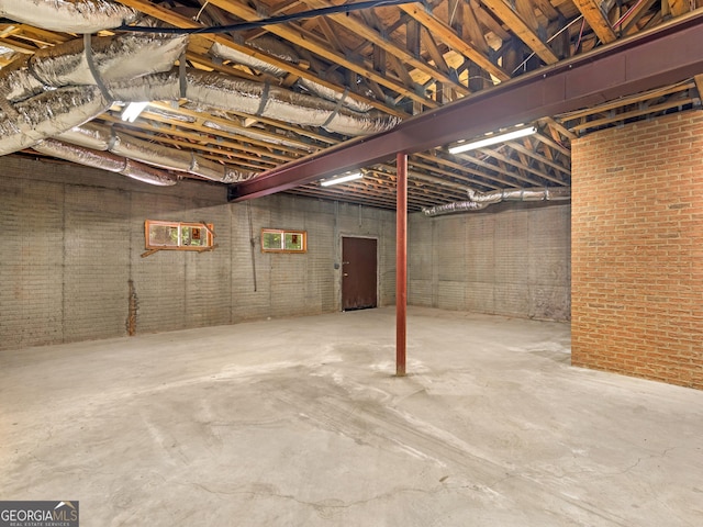 unfinished basement with brick wall