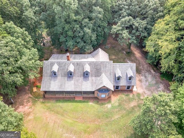 aerial view featuring a wooded view