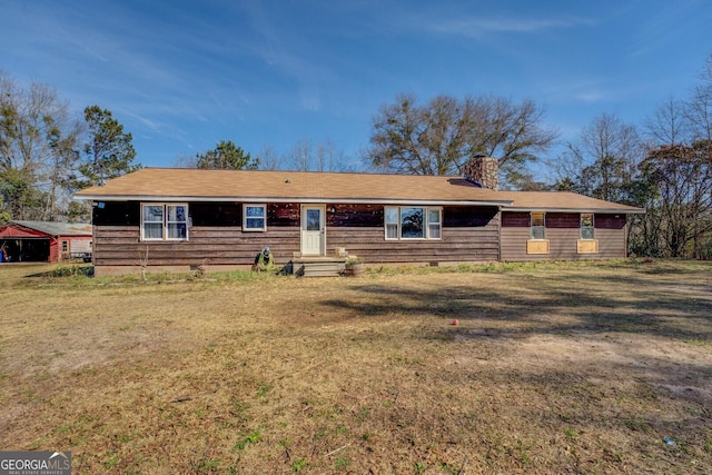 single story home featuring crawl space, a chimney, and a front lawn