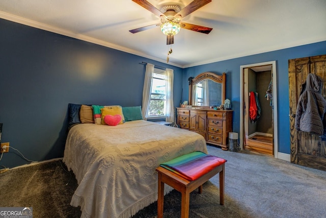 carpeted bedroom featuring a ceiling fan, baseboards, and crown molding