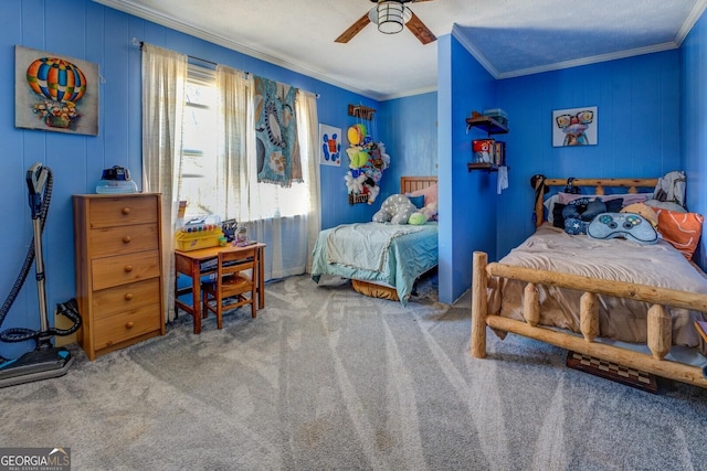 carpeted bedroom featuring ceiling fan and crown molding