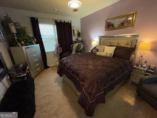 bedroom with light colored carpet