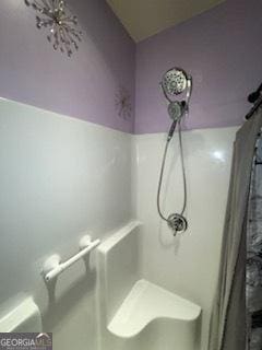 full bathroom with a shower and toilet