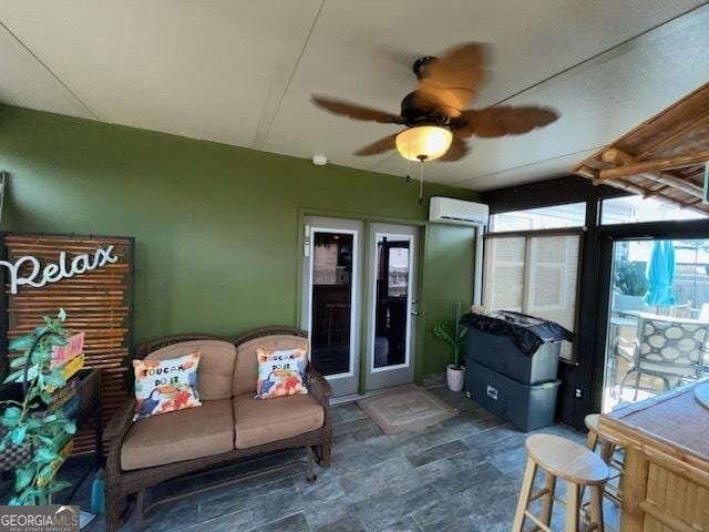 sunroom / solarium featuring ceiling fan and a wall mounted AC