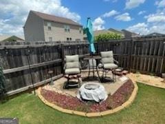 view of yard with a fenced backyard and a patio