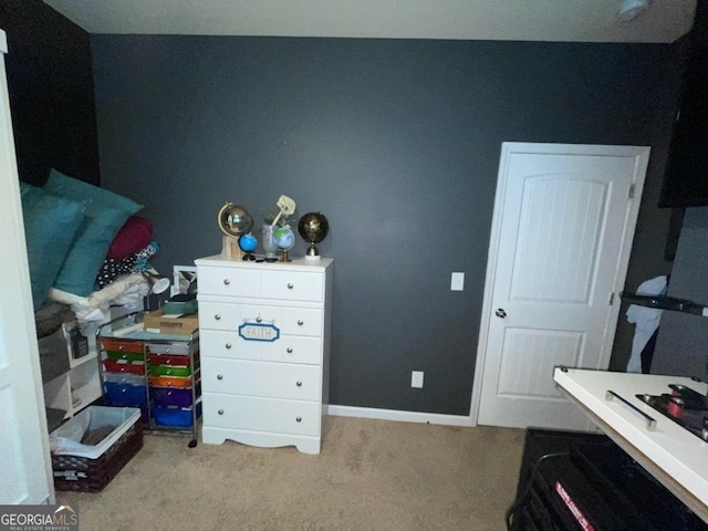 bedroom featuring carpet flooring and baseboards