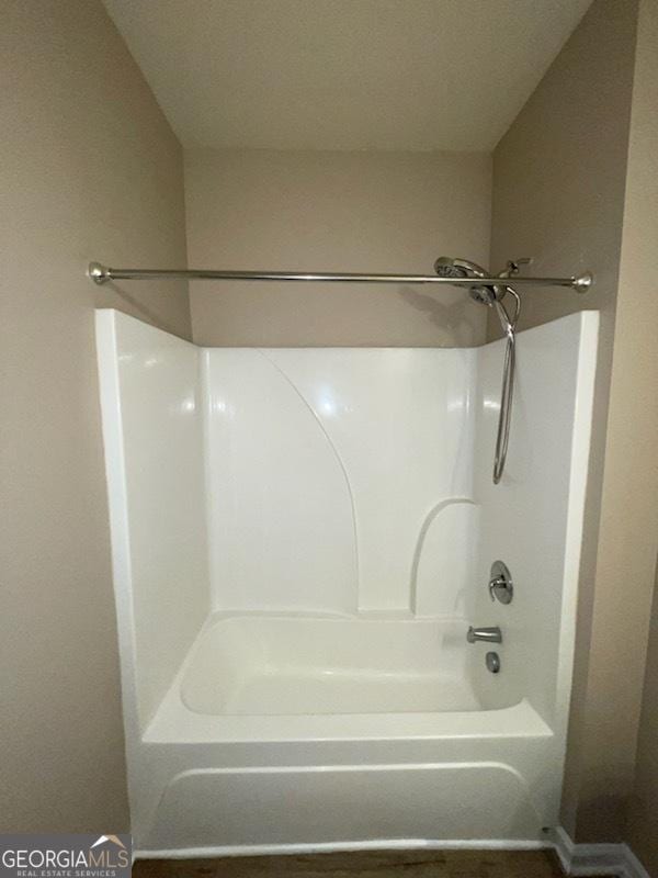 full bath featuring bathtub / shower combination