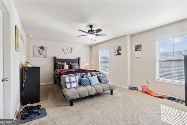 bedroom with carpet floors, ceiling fan, and baseboards