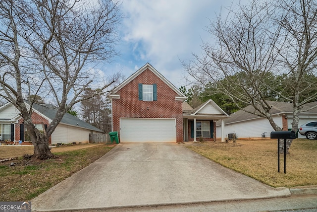 traditional home featuring a garage, a front lawn, concrete driveway, and brick siding