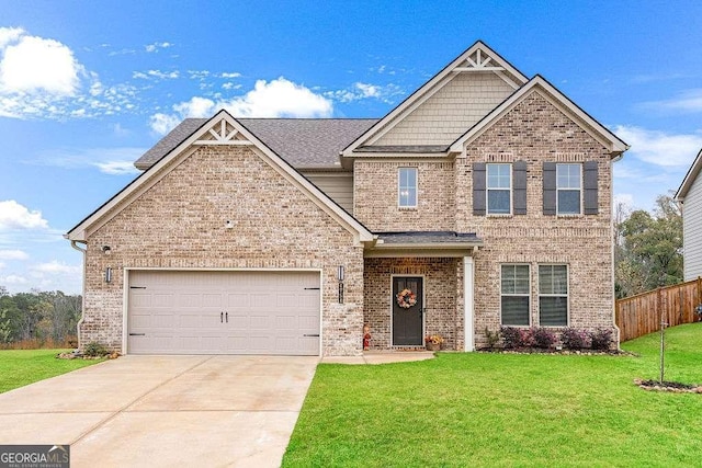 craftsman-style home with a garage, brick siding, driveway, and a front lawn