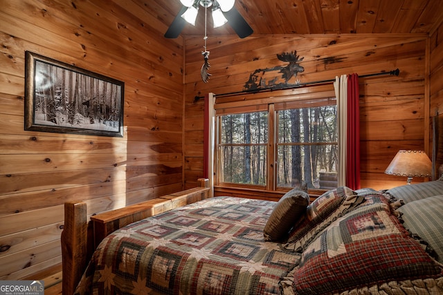 bedroom with vaulted ceiling, wood ceiling, and wood walls