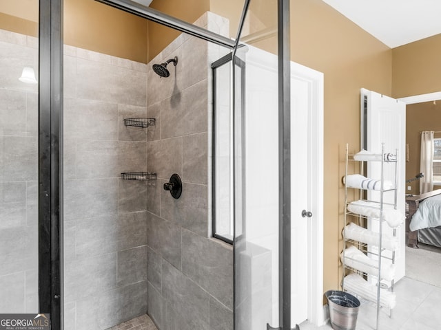 bathroom featuring a stall shower and connected bathroom