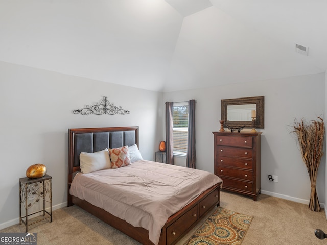 bedroom with light colored carpet, vaulted ceiling, visible vents, and baseboards