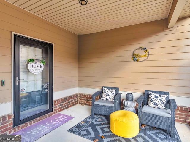 view of exterior entry featuring brick siding