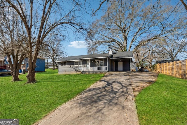 view of front of property with driveway, a chimney, crawl space, covered porch, and a front yard