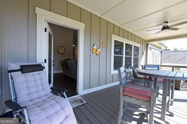 deck featuring covered porch and a ceiling fan