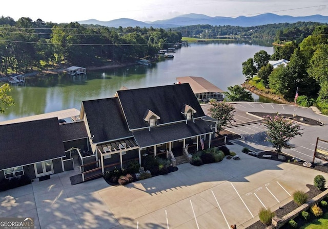 bird's eye view featuring a water and mountain view