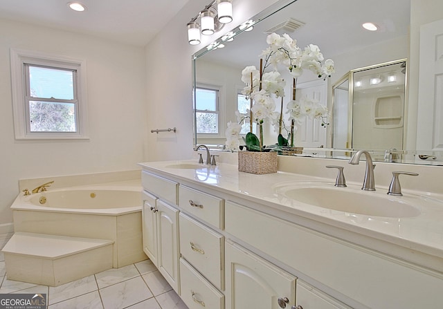 bathroom with a healthy amount of sunlight, visible vents, and a sink