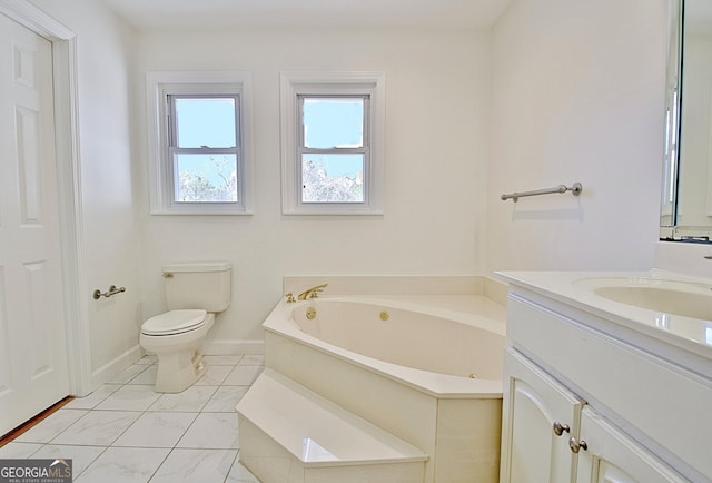 bathroom with toilet, baseboards, a bath, and vanity