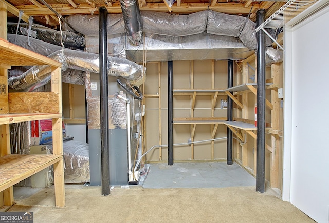 unfinished basement featuring heating unit