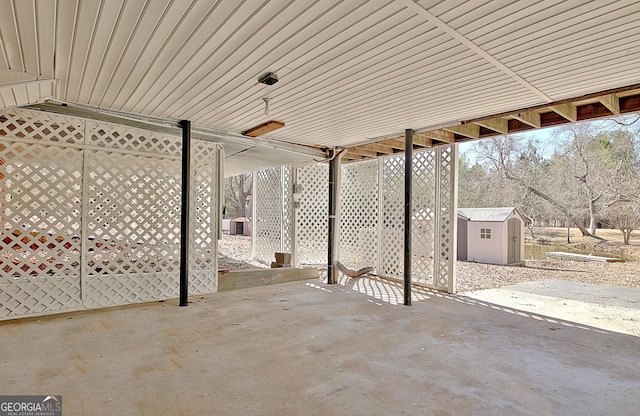 view of patio / terrace featuring an outbuilding and a storage unit