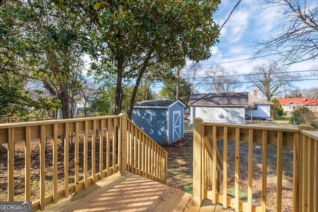 wooden terrace with a shed and an outdoor structure