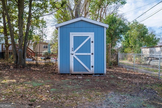 view of shed with fence