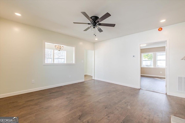 spare room featuring recessed lighting, dark wood finished floors, baseboards, and ceiling fan