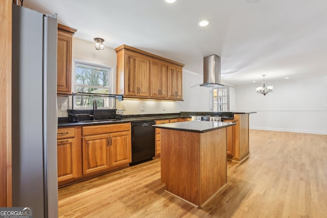 kitchen with black dishwasher, island range hood, freestanding refrigerator, a peninsula, and a sink