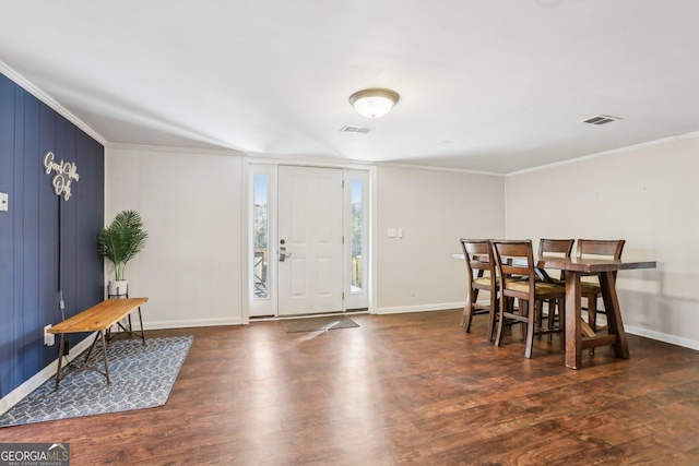 entryway featuring visible vents, wood finished floors, and ornamental molding