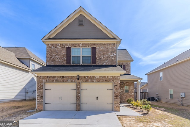 traditional-style home featuring a garage, central air condition unit, concrete driveway, and brick siding