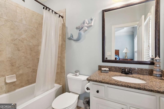 bathroom featuring toilet, shower / bath combination with curtain, and vanity