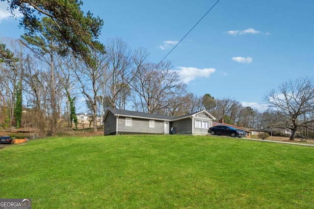 view of home's exterior with a lawn