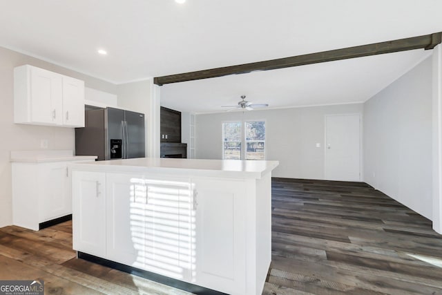 kitchen with dark wood-style floors, white cabinetry, stainless steel refrigerator with ice dispenser, and a center island