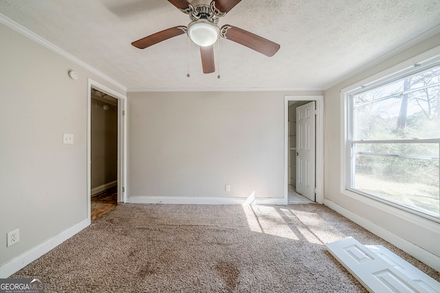 3524 Exeter Ct, Snellville, GA 30039 - empty room featuring carpet, crown molding, ceiling fan, a textured ceiling, and baseboards