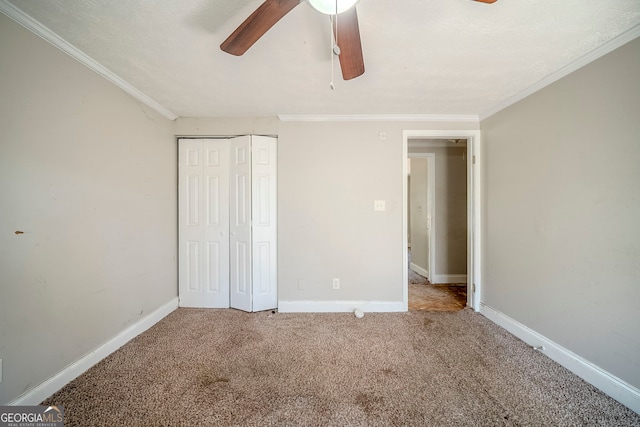 3524 Exeter Ct, Snellville, GA 30039 - unfurnished bedroom featuring carpet, a closet, ornamental molding, a ceiling fan, and baseboards