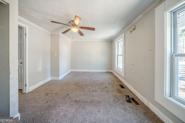 3524 Exeter Ct, Snellville, GA 30039 - empty room featuring baseboards, visible vents, a ceiling fan, ornamental molding, and carpet flooring