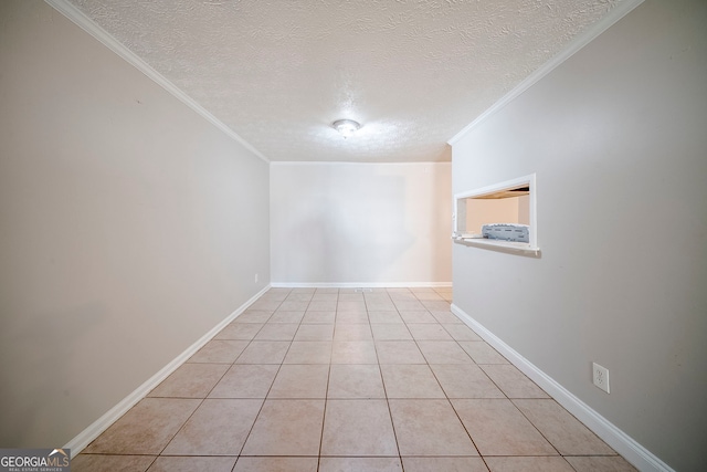 3524 Exeter Ct, Snellville, GA 30039 - unfurnished room with baseboards, ornamental molding, a textured ceiling, and light tile patterned flooring