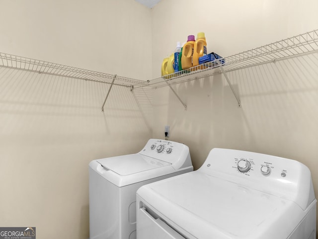 washroom featuring laundry area and washer and dryer