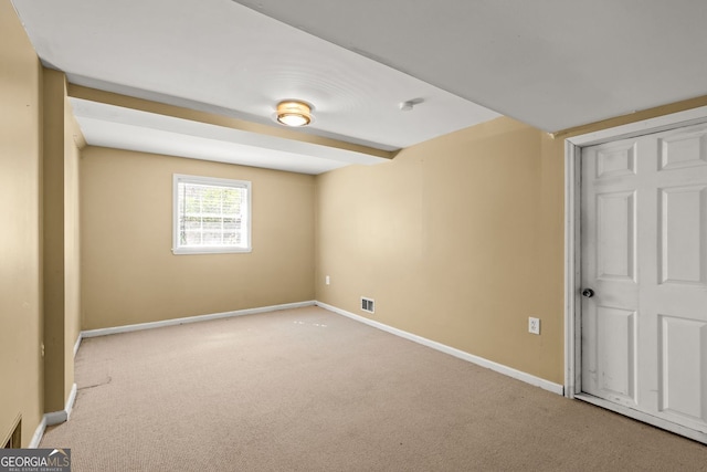 unfurnished bedroom with carpet floors, visible vents, and baseboards