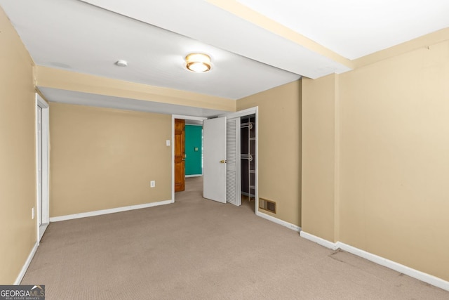 unfurnished bedroom with carpet floors and baseboards