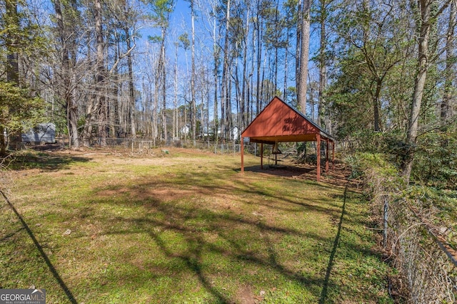 view of yard featuring fence and a gazebo