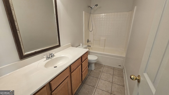 bathroom featuring tub / shower combination, vanity, toilet, and tile patterned floors