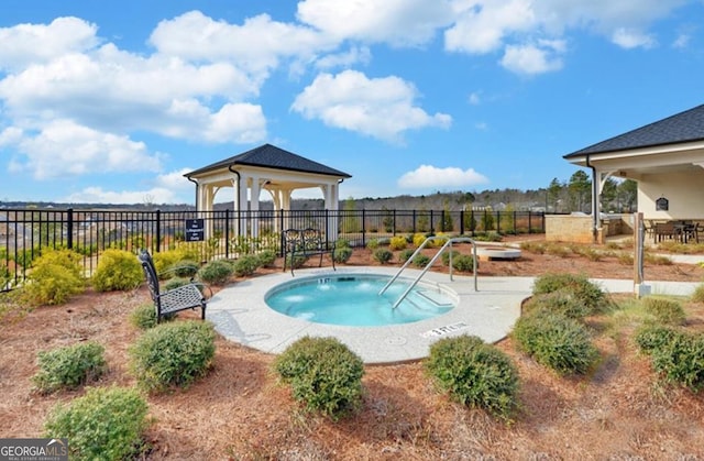 view of pool featuring a gazebo and fence